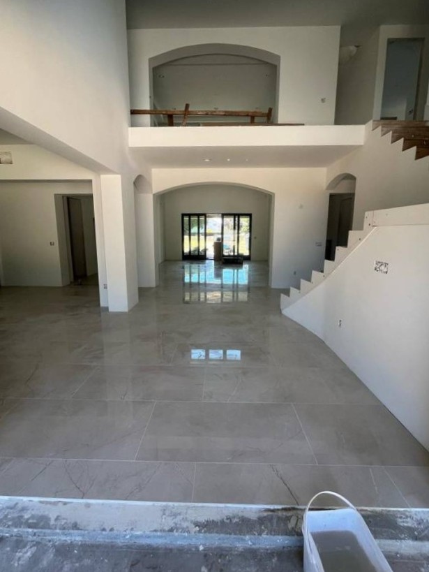 Professional flooring and fence contractor showcasing modern tiled flooring in Bay Area home